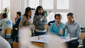Diverse team working together in strategic offsite
