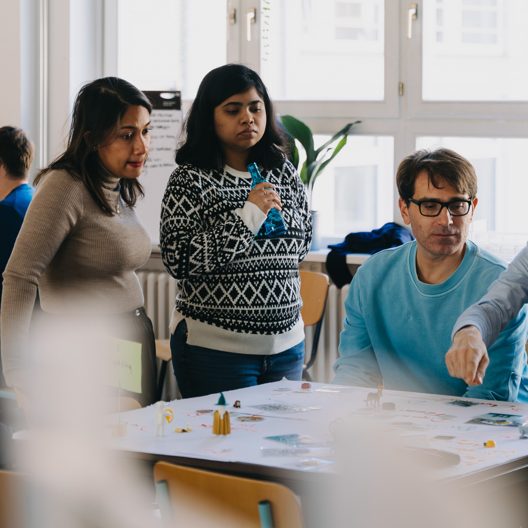 Diverse team working together in strategic offsite